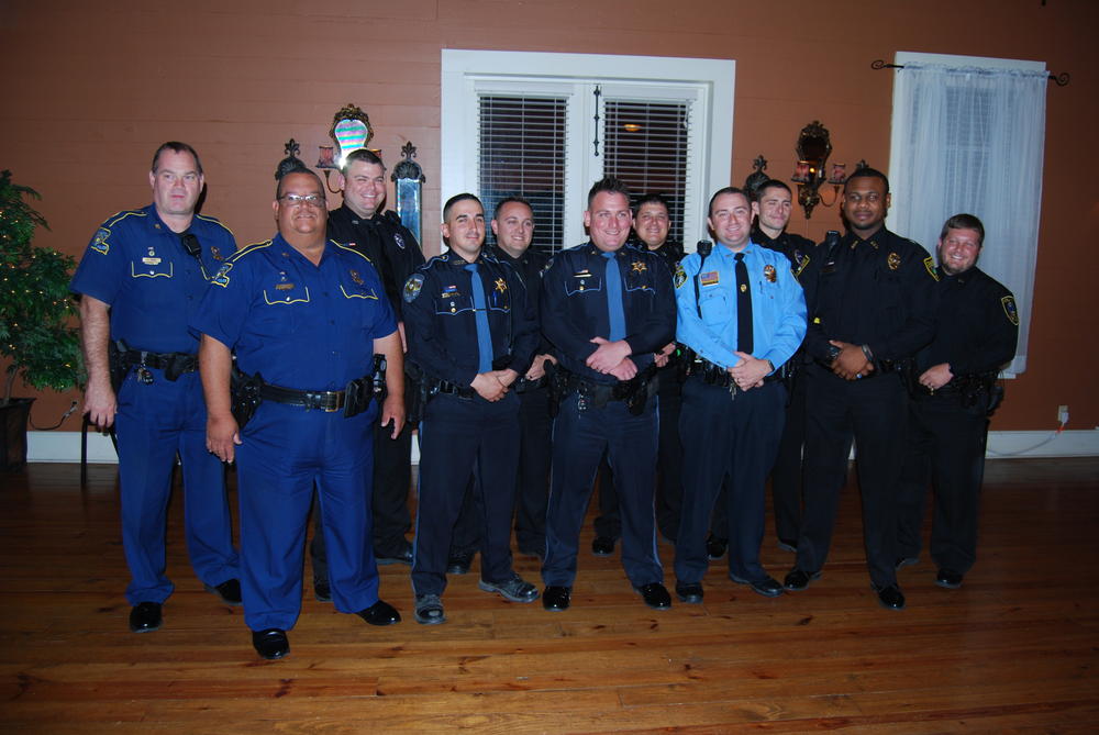 11 officers standing in uniform