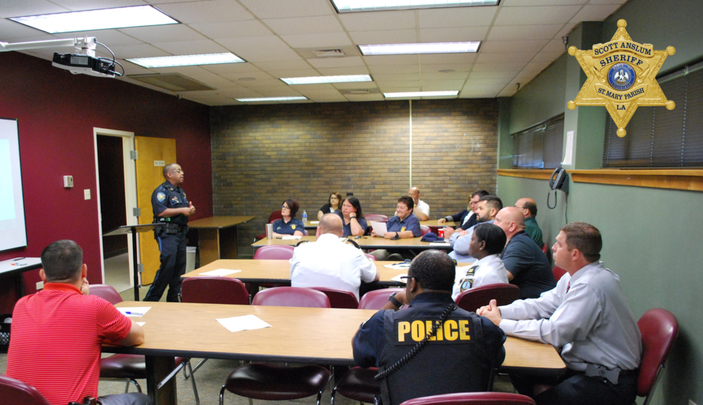SRO presenting information to a group of officers