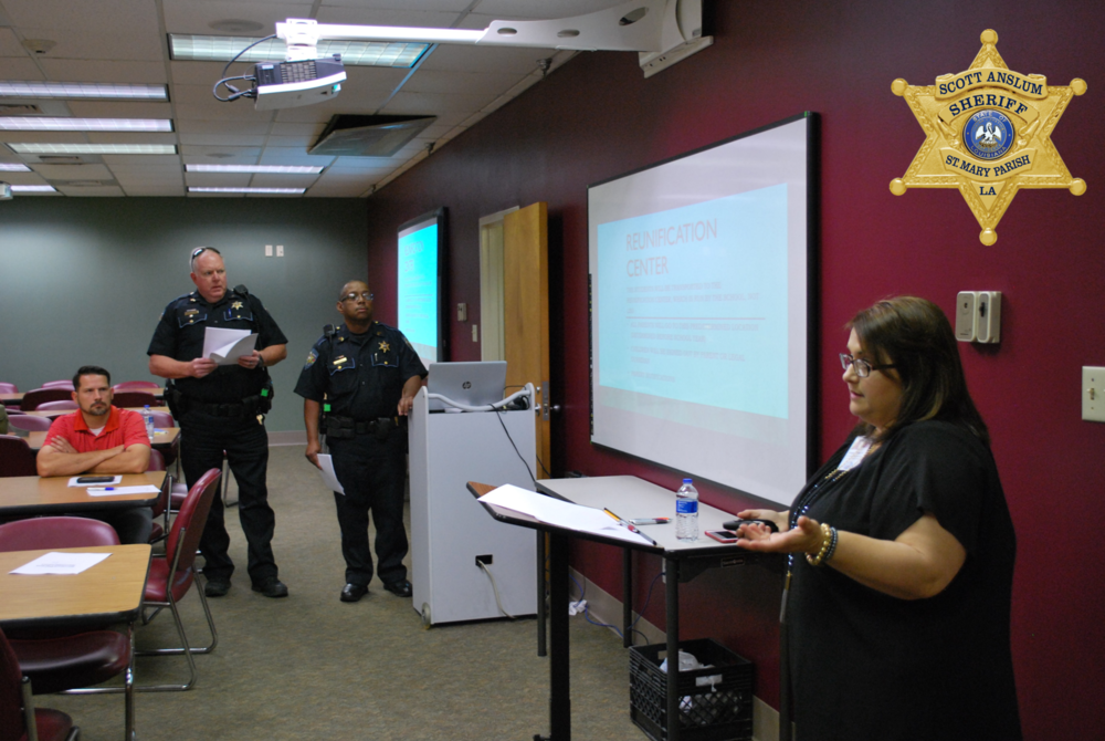 Woman speaking to a room of officers