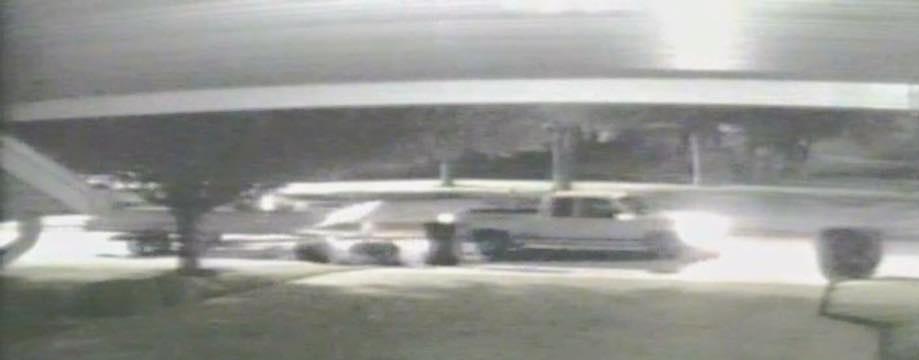 white 4-door truck from security camera footage