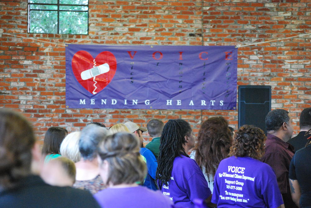 Banner on wall that says VOICE Mending Hearts